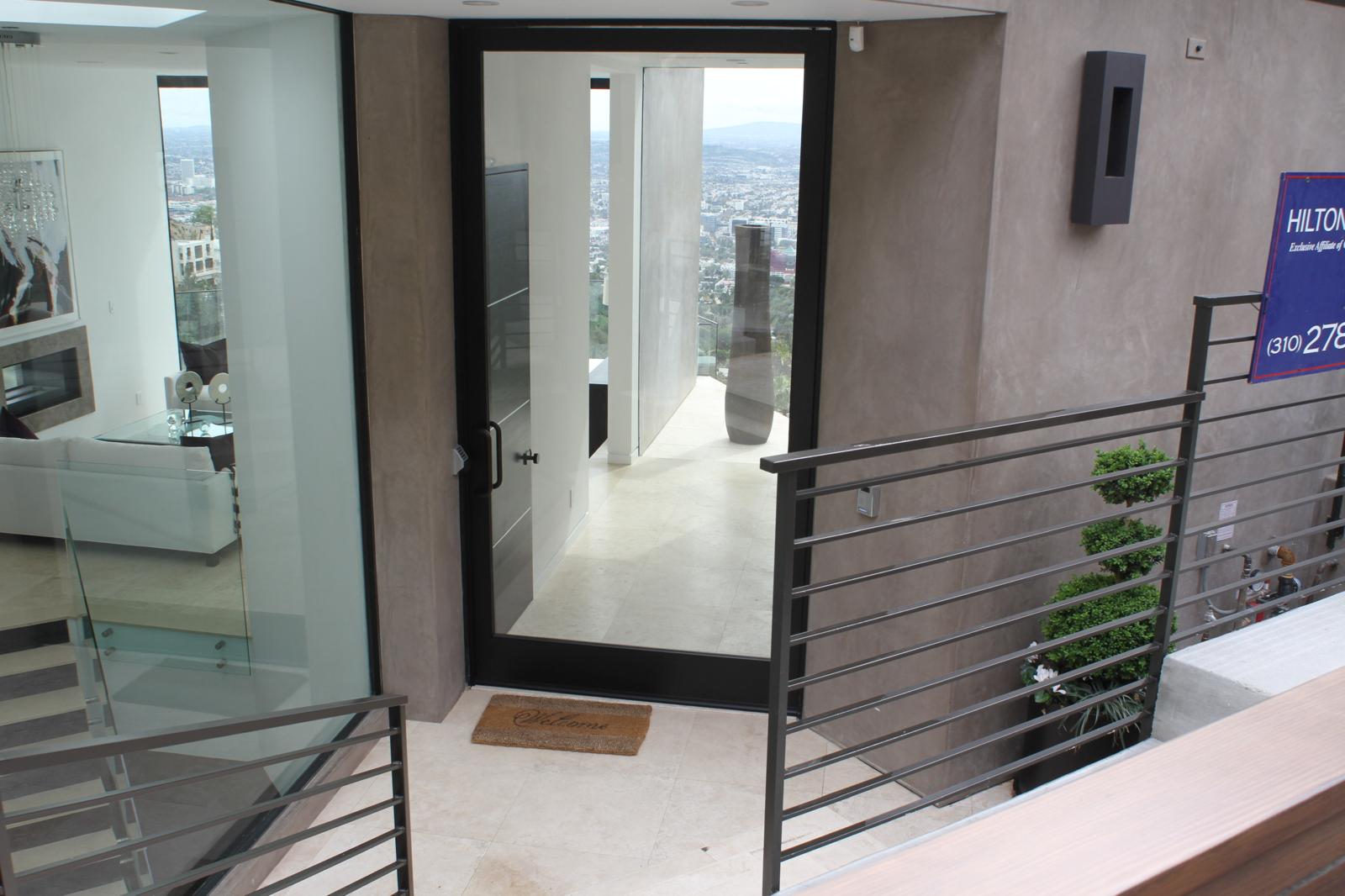 Glass-Walled Pivot-Door Entry